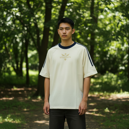 Beige t-shirt with navy stripes on sleeves and neckline, featuring a logo on a white background